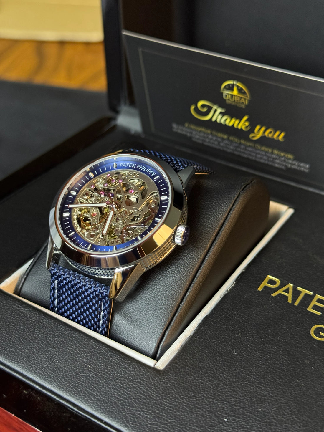 Patek Philippe Style Skeleton Dial Blue Chapter Ring Black Case Blue Mesh Strap