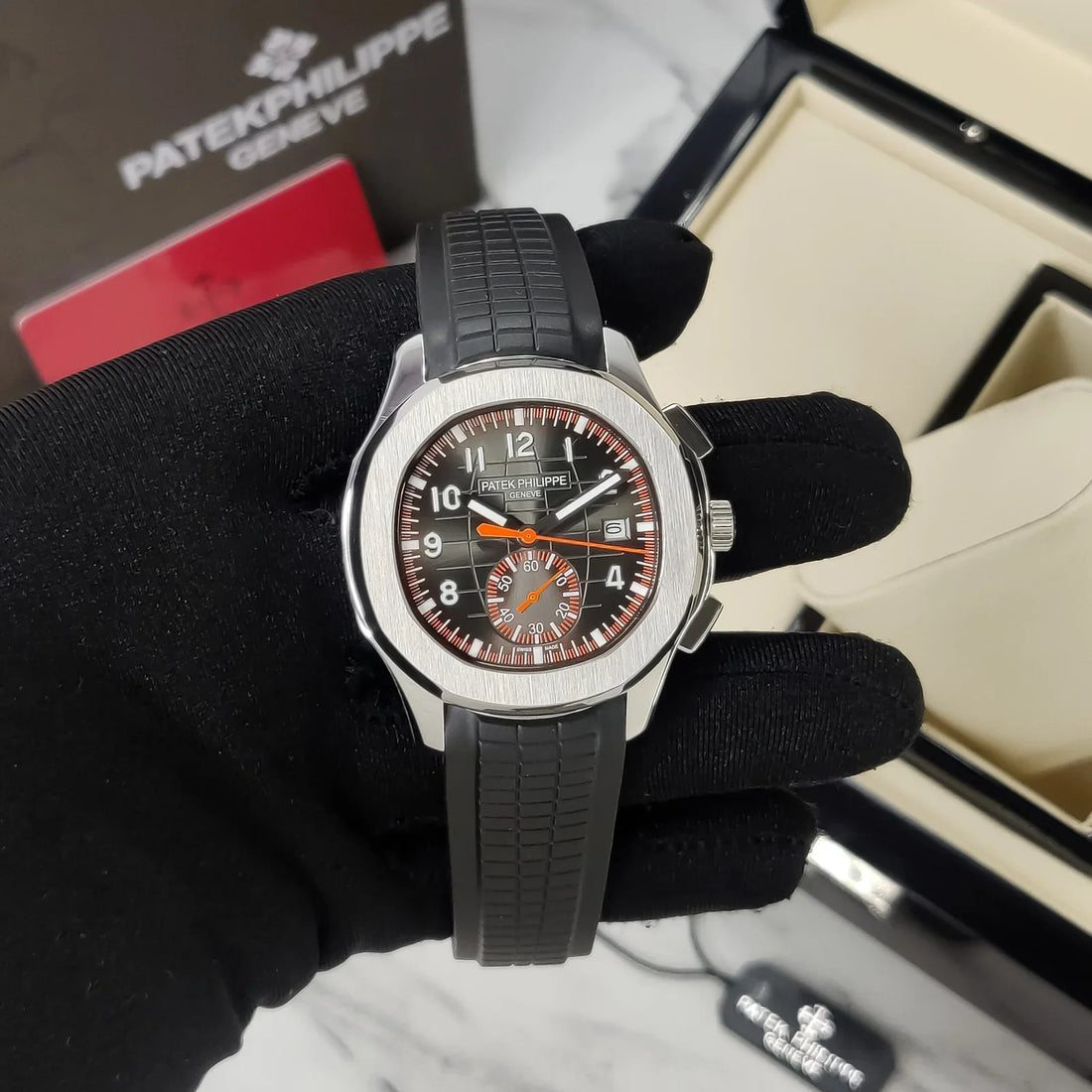 Patek Philippe Aquanaut Chronograph Stainless Steel Black Grid Dial Orange Accents Rubber Strap